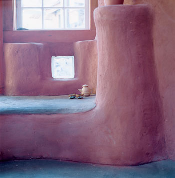 Jenn Rawling, one of a team of collaborators with Mark Lakeman, created the pottery for this space. The building has two cob shells separated by an insulating layer of straw—an unprecedented design. Fine cob plaster, colored with red oxide, finishes the interior and exterior walls.